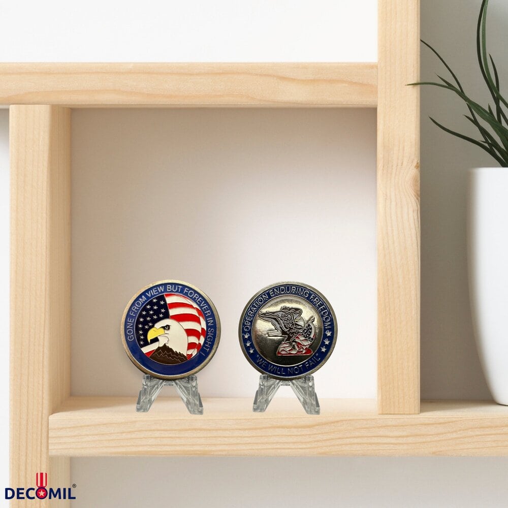 Military Challenge Coins, Operation Enduring Freedom are on the top of table
